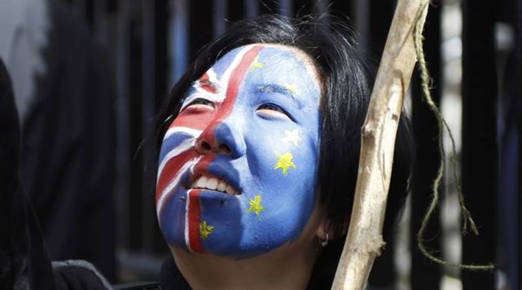 A woman looks upwards during a demonstration in BREXIT