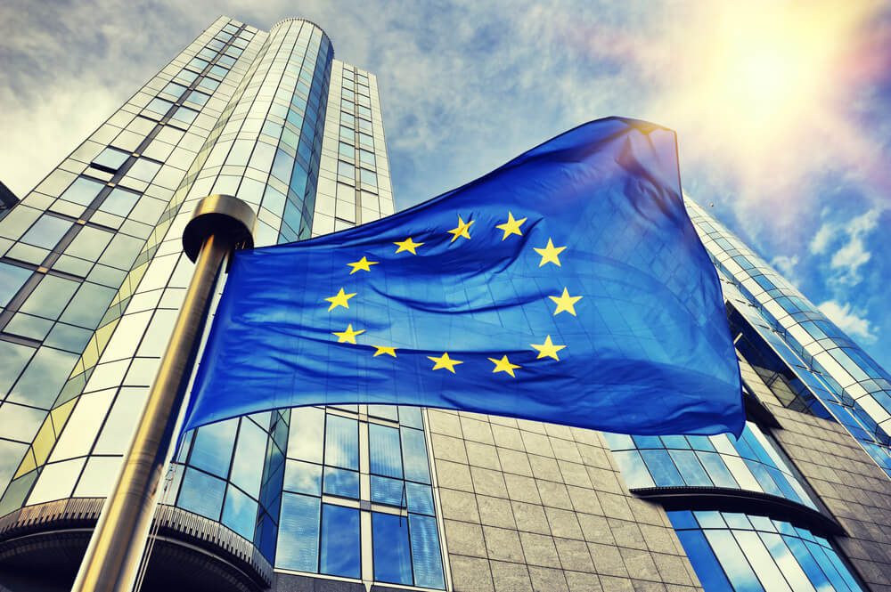 EU flag waving in front of European Parliament building. Brussels Belgium 1