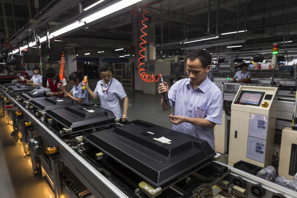 China also reported Caixin manufacturing index PMI Workers assemble TV in TCL television assembly factory.