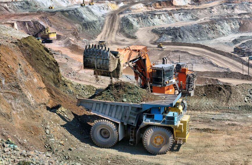 Australia Loading of iron ore on very big dump body truck